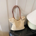Beige geflochtene Strandtasche mit braunen Ledergriffen und Innenfutter aus Stoff - Beige