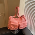Light pink corduroy tote bag with dual front flap pockets and adjustable metal buckles - Pink