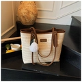 Beige woven straw tote bag with brown leather trim and white plush pompom charm - Beige