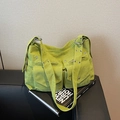 Avocado green corduroy tote bag with double front flap pockets and silver metal eyelets - Green