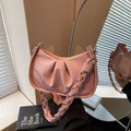 Pink lychee leather pleated underarm bag with a woven braided shoulder strap - Pink
