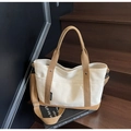 Detail of canvas tote bag showing cream and camel contrast panels with reinforced handles - Off-white