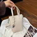 Mini cream faux leather tote bag with silver heart pendant and fashion engraving - Off White