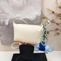 Minimalist off-white pebbled leather pillow bag with cute blue elephant charm pendant - Coconut Milk White With Pendant