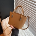Structured camel tote bag in litchi grain leather with silver ball accents and crossbody strap - Brown