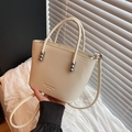 Cream white bucket bag with pebble leather texture and silver stud details - Khaki