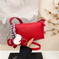 Red pebbled leather crossbody bag featuring a large elephant charm and thin strap - Ankora Red With Charms