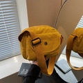 Bright yellow waterproof nylon crossbody bag with adjustable strap and metal logo detail - Yellow