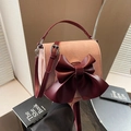 Pink and burgundy bow saddle bag with top handle and adjustable shoulder strap - Pink