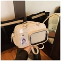 Close-up of beige glossy PU tote bag with transparent window and cartoon insert card - Pink