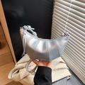 Metallic silver pleated croissant bag featuring knotted strap and sleek zipper detail - Pearl Silver