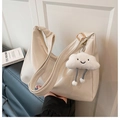 Detail of cream white faux leather hobo bag with gold buckle and plush cloud charm - White with Pendant