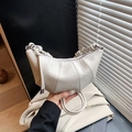 Chic beige half-moon pleated bag with knotted handle and elegant metal hardware detail - Creamy White