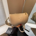 Beige cylinder pillow bag in lychee leather with a geometric woven shoulder strap - Off-white