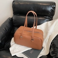 Brown pebble leather bowling handbag with silver hardware and long shoulder straps - Brown