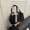 Chic black Boston handbag in litchi grain leather with Just For You ribbon detail - Black