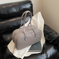 Taupe pebbled leather bowling handbag with long double handles and silver zipper closure - Gray