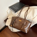 Retro brown gloss shoulder bag with golden hardware and decorative woven pendant - Yellow Brown With Pendant