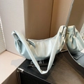 Minimalist light blue pleated croissant bag with a knotted strap in a premium PU finish - Light Blue