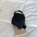 Fashionable black nylon mini shell bag with double zippers and a plush ball charm - Black (With Pendant)