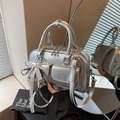 Silver metallic Boston bag with dual pockets, pearl bow charm and crossbody strap - Silver (With Pendant)