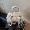 Light blue faux leather Boston bag with decorative pearl lace charm and belt buckle details - Light Blue (With Pendant)