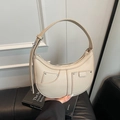Cream-white crescent moon bag in pebble leather with studded front pockets - Khaki