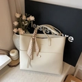 Minimalist beige textured leather tote bag with decorative scarf for women commuting - Off White