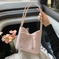 Pink PU leather bucket bag with bow drawstring and metallic ball accents - Pink