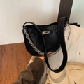 Chic black litchi grain bucket bag with silver metal twist lock and dual strap style - Black