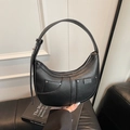 Black crescent hobo bag with litchi texture and silver rivets on front pockets - Black
