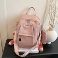 Pink lychee grain leather backpack with silver lock decor and matching coin purse charm - Pink