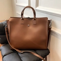 Brown large capacity leather tote bag with adjustable shoulder strap and silver button - Brown