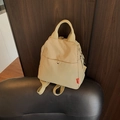 Versatile light beige crossbody backpack with adjustable straps on leather seat - Khaki