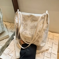 Beige Hanfu bucket bag with metallic butterfly prints and grey decorative tassel - Silver