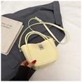 Creamy yellow bucket bag with silver twist lock and adjustable shoulder strap - Yellow