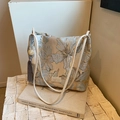 Elegant floral jacquard tote bag in gold and blue with leather handles and gray tassel - Blue
