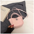 Pink leather bucket bag with metallic twist lock and adjustable shoulder strap - Pink