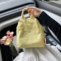 Pale yellow nylon chest bag with wrinkled texture and magnetic front pocket - Yellow