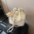 Cream white drawstring bucket bag with marble texture and plush teddy dog keychain - With Charm / Off White