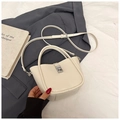 Minimalist creamy white leather bucket handbag with silver lock and adjustable strap - White