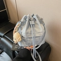 Light blue drawstring bucket bag with pleated texture and cute teddy bear charm - With Charm / Blue