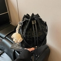 Fashionable black drawstring bucket bag with a cute beige plush puppy pendant charm - With Charm / Black