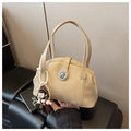 Detail of beige patent leather bowling bag with silver lock and pearl doll keychain - Khaki with Pendant
