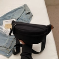 Versatile black canvas chest bag with adjustable shoulder strap and orange logo detail - Black