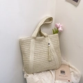 Chic beige straw tote bag with elegant tassels and wooden beads in a resort style - Off-white