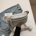 Light grey-green canvas crossbody chest bag with adjustable strap and embossed logo - Gray