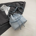 Light blue drawstring bucket bag with cracked texture and adjustable silver hardware strap - No Pendant / Blue