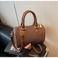 Detail of a brown Boston handbag featuring fine texture fabric and adjustable shoulder strap - Cocoa Brown