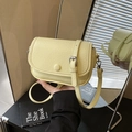 Fashionable light yellow crossbody bag with wrinkled texture and silver hardware - Yellow